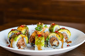 Sushi Blues Café signature dishes Godzilla Roll, Thrill is Gone Roll, Funky Chicken Roll, Tuna Dumplings